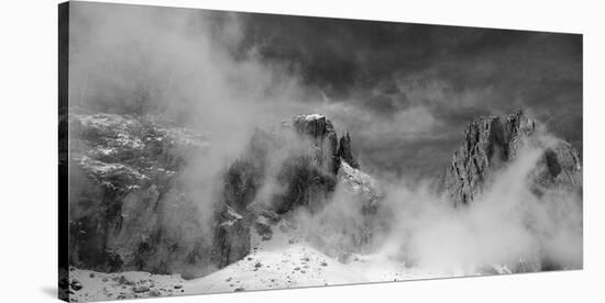 Clouds hang between the mountains of the Dolomites-Jean Schwarz-Stretched Canvas