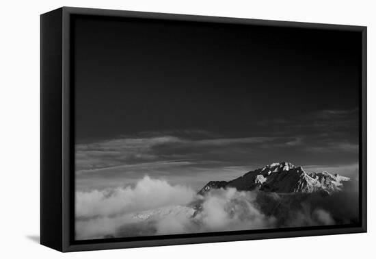 Clouds hang between the mountains of the Dolomites-Jean Schwarz-Framed Stretched Canvas