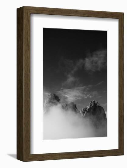 Clouds hang between the mountains of the Dolomites-Jean Schwarz-Framed Photographic Print