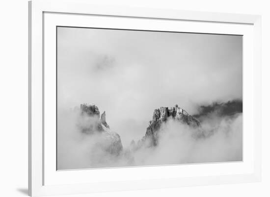 Clouds hang between the mountains of the Dolomites-Jean Schwarz-Framed Photographic Print