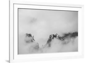 Clouds hang between the mountains of the Dolomites-Jean Schwarz-Framed Photographic Print