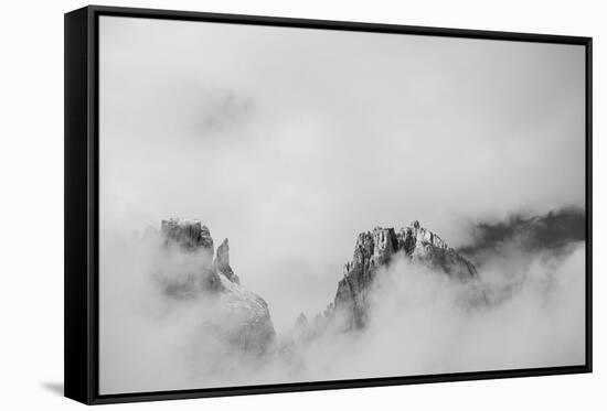 Clouds hang between the mountains of the Dolomites-Jean Schwarz-Framed Stretched Canvas