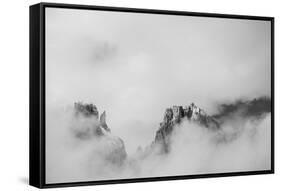 Clouds hang between the mountains of the Dolomites-Jean Schwarz-Framed Stretched Canvas