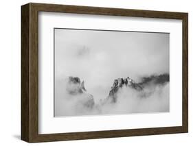 Clouds hang between the mountains of the Dolomites-Jean Schwarz-Framed Photographic Print