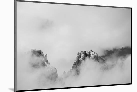 Clouds hang between the mountains of the Dolomites-Jean Schwarz-Mounted Photographic Print