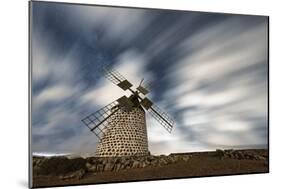 Clouds in the starry sky over a traditional windmill, La Oliva, Fuerteventura, Canary Islands-Roberto Moiola-Mounted Photographic Print