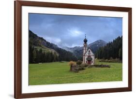 Clouds on Church of Ranui surrounded by meadows and woods in the fall, St. Magdalena, Funes Valley,-Roberto Moiola-Framed Photographic Print