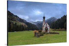 Clouds on Church of Ranui surrounded by meadows and woods in the fall, St. Magdalena, Funes Valley,-Roberto Moiola-Stretched Canvas