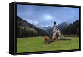 Clouds on Church of Ranui surrounded by meadows and woods in the fall, St. Magdalena, Funes Valley,-Roberto Moiola-Framed Stretched Canvas