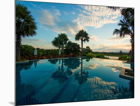 Clouds reflected in the infinity pool at sunrise, Aureum Palace Hotel, Bagan, Mandalay Region, M...-null-Mounted Photographic Print