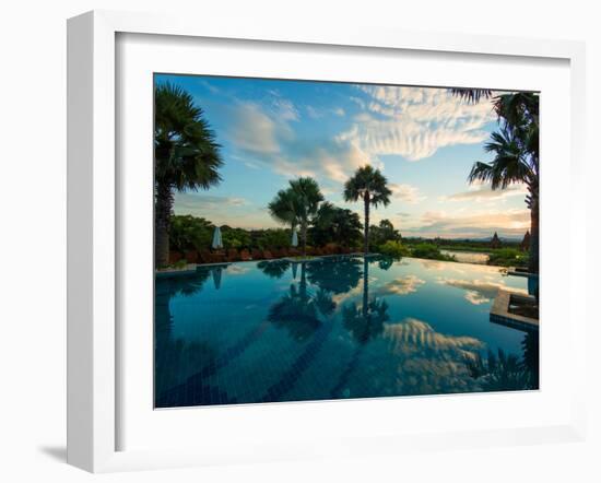 Clouds reflected in the infinity pool at sunrise, Aureum Palace Hotel, Bagan, Mandalay Region, M...-null-Framed Photographic Print