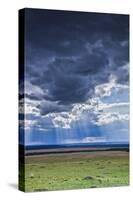 Clouds with sun rays streaming down on Masai Mara in Kenya, Africa.-Larry Richardson-Stretched Canvas