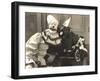 Clown Posing with Dog Dressed in Clown Costume-null-Framed Photo