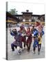 Clowns in Carved Wooden Masks Entertaining Spectators at the Wangdue Phodrang Tsechu, Wangdue Phodr-Lee Frost-Stretched Canvas