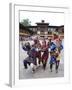 Clowns in Carved Wooden Masks Entertaining Spectators at the Wangdue Phodrang Tsechu, Wangdue Phodr-Lee Frost-Framed Photographic Print