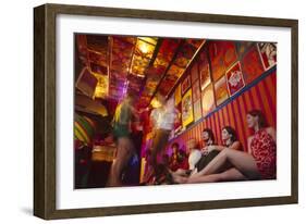 Clubgoers Against a Wall Decorated with Psychedelic Art and Posters, New York, New York, 1967-Yale Joel-Framed Photographic Print