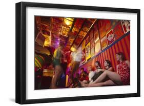 Clubgoers Against a Wall Decorated with Psychedelic Art and Posters, New York, New York, 1967-Yale Joel-Framed Photographic Print