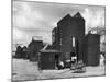 Clustered on the Shingle of the Old Town of Hastings Sussex are These Tall Black Huts-Fred Musto-Mounted Photographic Print