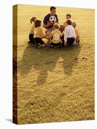 Coach with Youth Soccer Players-null-Stretched Canvas