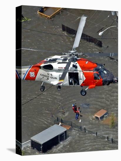 Coast Guard Rescues One from Roof Top of Home, Floodwaters from Hurricane Katrina Cover the Streets-null-Stretched Canvas