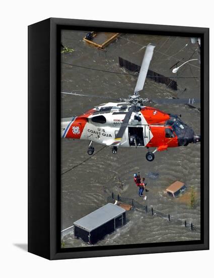 Coast Guard Rescues One from Roof Top of Home, Floodwaters from Hurricane Katrina Cover the Streets-null-Framed Stretched Canvas