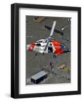 Coast Guard Rescues One from Roof Top of Home, Floodwaters from Hurricane Katrina Cover the Streets-null-Framed Photographic Print