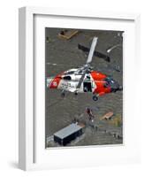 Coast Guard Rescues One from Roof Top of Home, Floodwaters from Hurricane Katrina Cover the Streets-null-Framed Photographic Print