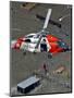 Coast Guard Rescues One from Roof Top of Home, Floodwaters from Hurricane Katrina Cover the Streets-null-Mounted Photographic Print