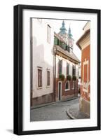 Cobblestone Street and Narrow Buildings with Church Towers in Background, Eger, Hungary-Kimberly Walker-Framed Premium Photographic Print