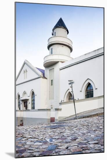 Cobblestones and the Exterior of a Church in Bo-Kaap Residential District-Kimberly Walker-Mounted Photographic Print