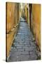 Cobblestones and yellow walls in alleyway, Hoi An, Vietnam-David Wall-Stretched Canvas