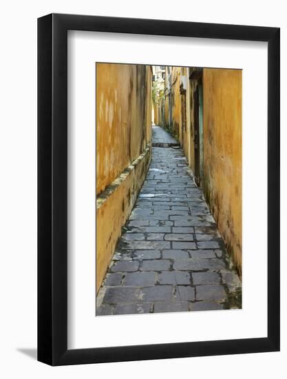 Cobblestones and yellow walls in alleyway, Hoi An, Vietnam-David Wall-Framed Photographic Print