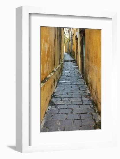 Cobblestones and yellow walls in alleyway, Hoi An, Vietnam-David Wall-Framed Photographic Print