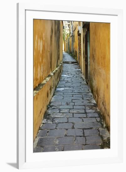 Cobblestones and yellow walls in alleyway, Hoi An, Vietnam-David Wall-Framed Photographic Print