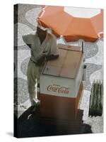 Coca-Cola Vendor Leaning on Cart with Umbrella on Mosaic Sidewalk, Copacabana Beach, Rio de Janeiro-Dmitri Kessel-Stretched Canvas