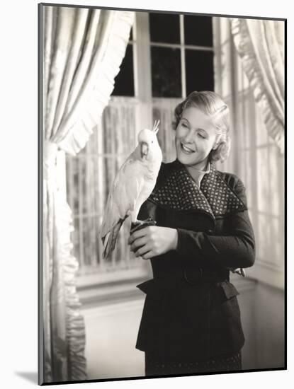 Cockatoo Perched on Woman's Hand-null-Mounted Photo