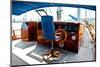 Cockpit inside a Boat with a Wood Wheel and Leather Chair.-Selenka-Mounted Photographic Print