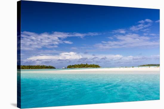 Coconut palm trees line the beach on One Foot Island, Aitutaki, Cook Islands, South Pacific Islands-Michael Nolan-Stretched Canvas