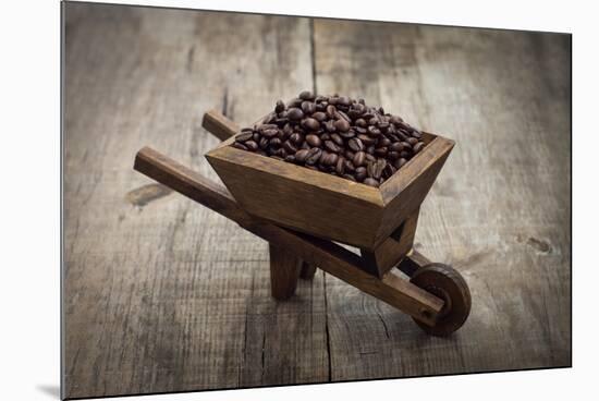 Coffee Beans In A Wheelbarrow-kbuntu-Mounted Art Print