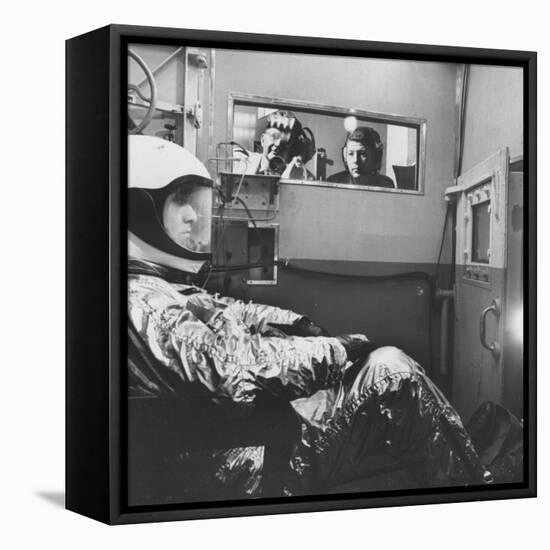 Col. John P. Stapp Watching a Subject in the Altitude Chamber-null-Framed Stretched Canvas