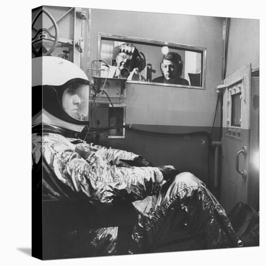 Col. John P. Stapp Watching a Subject in the Altitude Chamber-null-Stretched Canvas