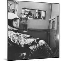 Col. John P. Stapp Watching a Subject in the Altitude Chamber-null-Mounted Photographic Print