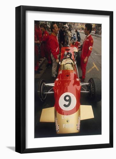 Colin Chapman and a Mechanic in Discussion over Graham Hill's Lotus, Monaco Grand Prix, 1969-null-Framed Photographic Print