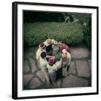 College Men and Woman Flipping a Coin on Purdue Campus, West Lafayette, Indiana 1954-Nina Leen-Framed Photographic Print