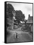 Collie Sheepdog Sitting in Road Leading Up Toward Castle Farm Owned by Beatrix Potter-George Rodger-Framed Stretched Canvas