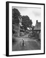 Collie Sheepdog Sitting in Road Leading Up Toward Castle Farm Owned by Beatrix Potter-George Rodger-Framed Photographic Print