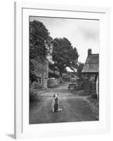 Collie Sheepdog Sitting in Road Leading Up Toward Castle Farm Owned by Beatrix Potter-George Rodger-Framed Photographic Print