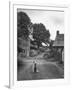 Collie Sheepdog Sitting in Road Leading Up Toward Castle Farm Owned by Beatrix Potter-George Rodger-Framed Photographic Print