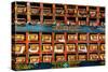 Color wall of books at buddhist monastery in Tengboche, Nepal on the way to Everest Base Camp-David Chang-Stretched Canvas
