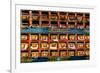 Color wall of books at buddhist monastery in Tengboche, Nepal on the way to Everest Base Camp-David Chang-Framed Photographic Print